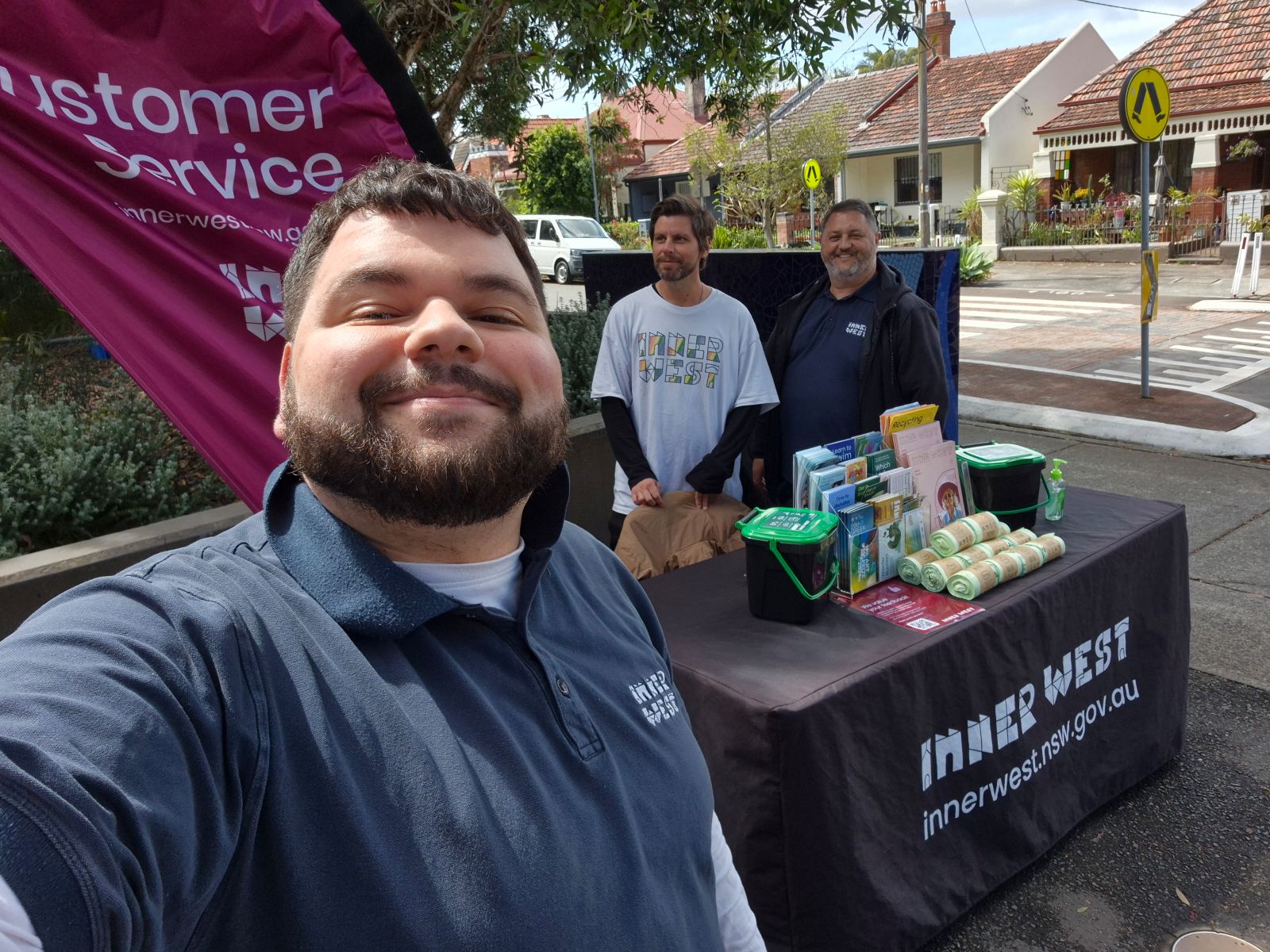 3 People standing at a customer service stall